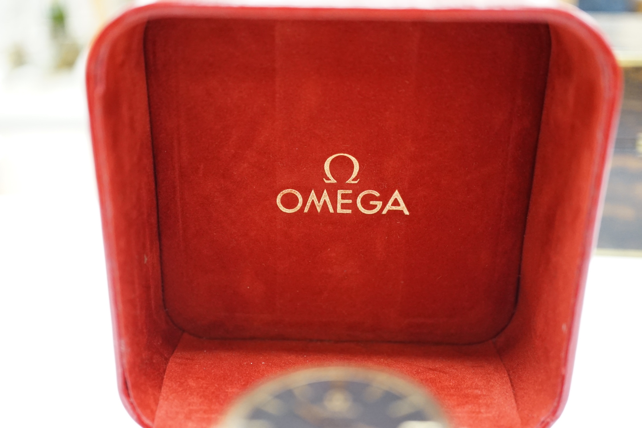 A gentleman's 9ct gold black dial manual wind wrist watch, with Omega box.